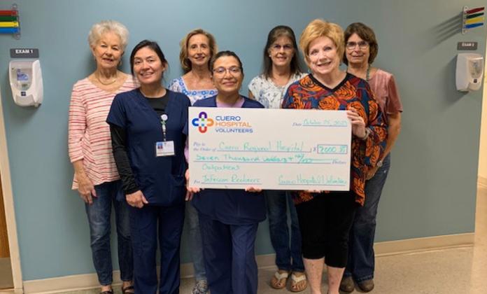 Emily Davis, Teresa Martinez, RN, Kristy Kahlich, Delia Semander, RN, Kaye Lane, Cindy Holcomb, and Sondra Wineinger. The check was for $7000.00 to be used to purchase Infusion Recliners for Outpatient. Department