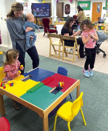 Parents and children at the CISD Early Learning Center Grand Reopening visit literacy stations at the new location of 502 Park Heights Drive. The Early Learning Center will be open on Wednesdays for families with children 0-4.