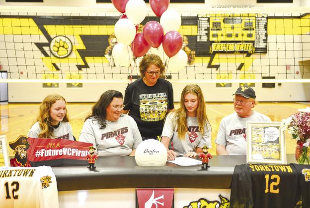 Emie was supported while signing by (from left to right) sister Katie Bolting, Mother Loretta Bolting, Coach Irma Gomez and father Wade Bolting. PHOTOS BY SARAH JOHNSTON/YORKTOWN NEWS-VIEW