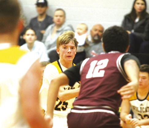 Starting point guard Brayden Knostman looks to pass to teammate Naranjo.