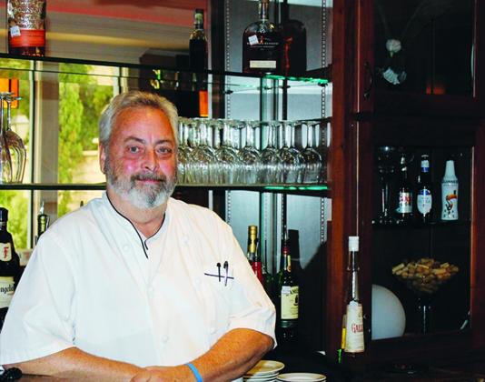 David Pipkin stands proudly behind the bar at Cuero’s Eagleford Restaurant, which is set to serve customers for the last time on Oct. 31.