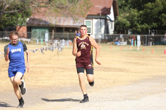 Connly Meeting turns the burners on and passes an opponent in last week's District 30-1A cross country meet held in Moulton. 