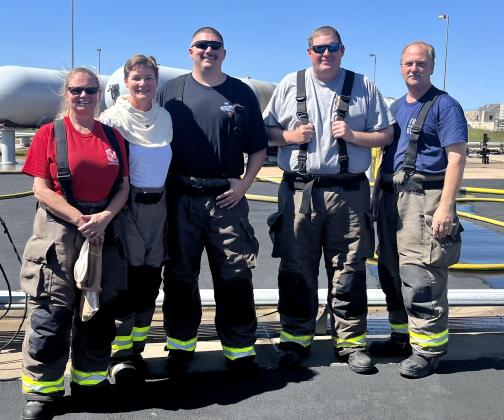 Training attendees, pictured right are, firefighters Marsha Knight and Stacy Gunderson; Chief Derrick Green, Asst. Chief Steven Caves, President Billy Fischer.