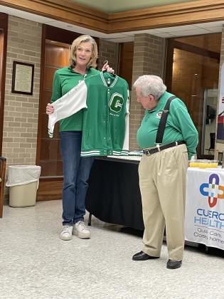 Lynn Falcone, CEO of Cuero Regional Hospital, presented Dr. Reese, one of Cuero’s biggest Gobbler fans, a letterman jacket at his retirement celebration.