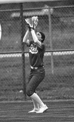 Rightfielder, Caroline Kubesch catches a fly ball.