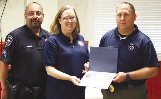 Melissa Alcazar, middle, recently graduated from the Cuero Citizen Police Academy. Pictured with Alcazar is City of Cuero Police Chief Steven Ellis, right, and Corporal Josh Serbin, left. CONTRIBUTED PHOTO