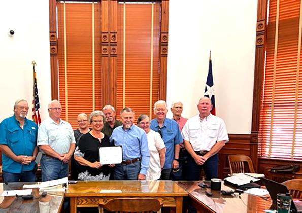 Judge Fowler presents the DeWitt County Historical Commission with the Texas Historical Commission 2022 Distinguished Service Award Certificate. The DeWitt County Historical Commission earned this award based on its active and well-balanced preservation program. Contributed Photo
