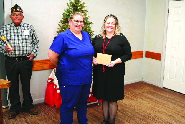 Amy Lamprecht awards Shannon Saunders with a scholarship check to assist her in furthering her nursing career. CONTRIBUTED PHOTO
