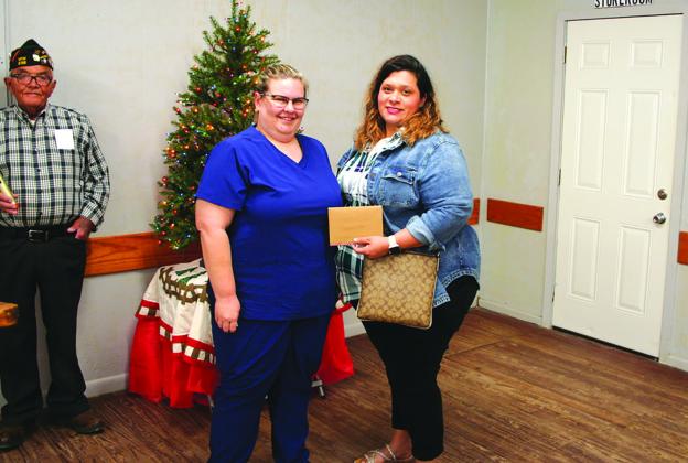 Amy Lamprecht presents Stephanie Villa with a scholarship check aimed at helping her with the cost of her nursing education. CONTRIBUTED PHOTO