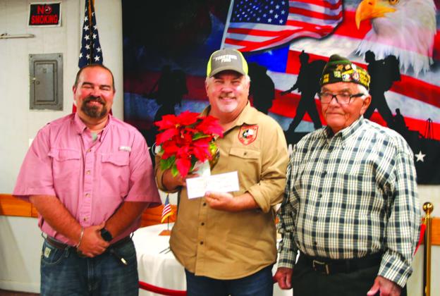 VFW members, Kevin Lamprecht and Karl Mueller, accept a donation from Clark Kerlick for their station. CONTRIBUTED PHOTO