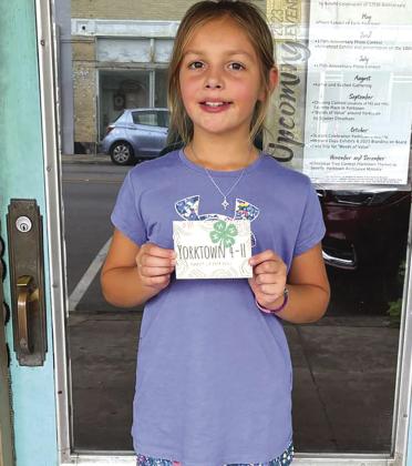 Emilee Friesenhahn leaves one of her 4H calling cards at Shear Designs. CONTRIBUTED PHOTO