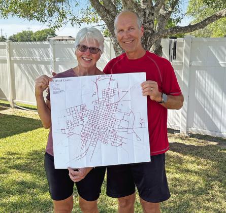 John and Jennifer Hudgeons, holding the map of Cuero that started them on their amazing local journey.