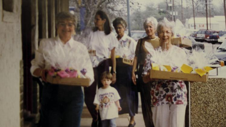Association members parade the cascarones to Main Street for their annual Easter fundraiser. (Photo courtesy of the DeWitt Heritage Museum)