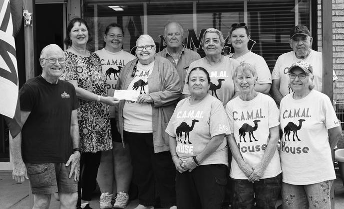 Ronnie Dietz, President of Hochheim Prairie Insurance Branch 2 and treasurer Cathy Hurta, presented a $500 donation to Nelda Freda Nelson for CAMAL House Food Pantry. Also pictured are CAMAL House volunteers. PHOTO BY SONYA TIMPONE/THE CUERO RECORD