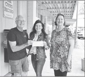 Ronnie Dietz, President of Hochheim Prairie Insurance Branch 2 presented a $200 donation to Cuero Soccer Association board member Sonya Timpone. PHOTO BY SHANNON HEIN0LD/THE CUERO RECORD