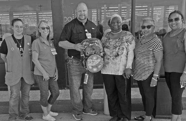 From left, Sarah Bixenmann, Connie Hall, store manager Nathan Polster, Viola Holman (Tri-County Founder), Vollie Griffin and Drosto Montgomery (Tri-County Empowerment Event Planner and board member)