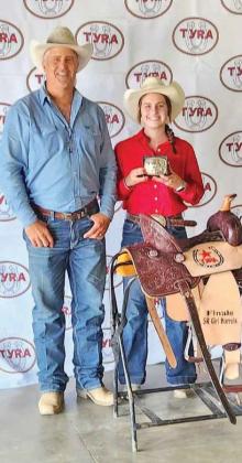 MacKenna Diebel celebrates her sweeping performance at the Texas Youth Rodeo Association competition in July.