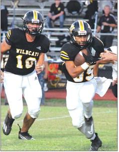Aidan Nunez carries the ball on his way to scoring three touchdowns, while teammate Ryan Knostman can be seen in the background. CONTRIBUTED PHOTO