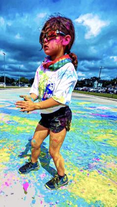 Above: Madelyn Hobbs was covered head to toe in colored powder at her run through of the Color-A-Thon. CONTRIBUTED PHOTO