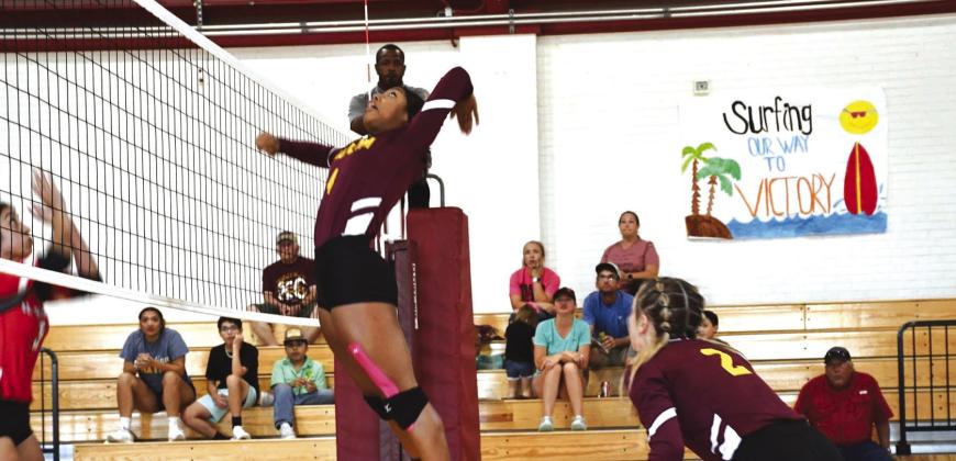 Sr Ariyana Blackwell goes up for the kill with Jr Abby Klein ready to cover a block. PHOTOS CONTRIBUTED BY SARA WILSON