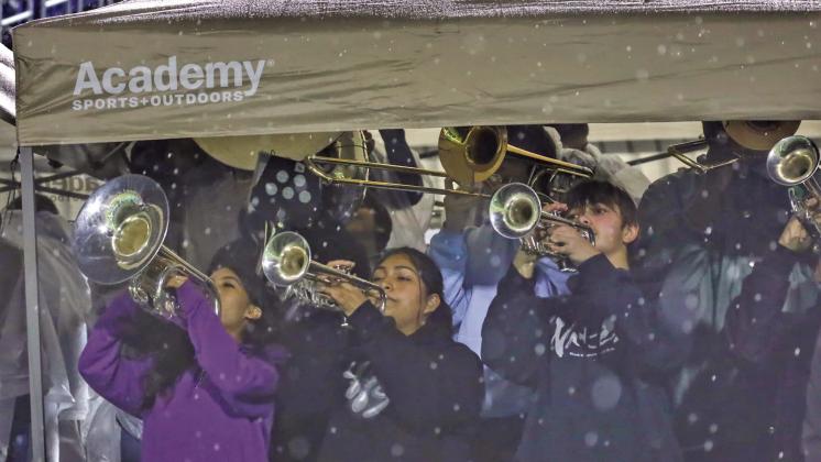(TOP) No matter the weather conditions, nothing can keep the amazing Cuero High School band from playing!