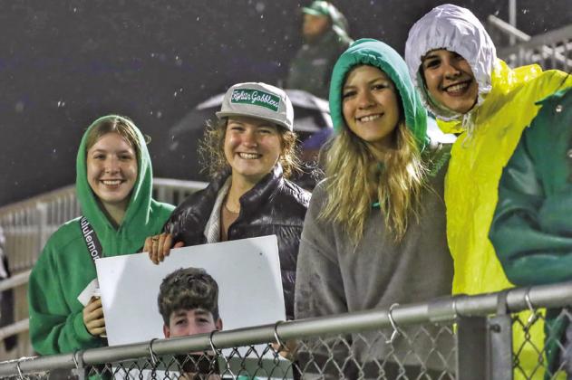 (LEFT) Cuero fans braved the cold and rain to support their Fightin’ Gobblers