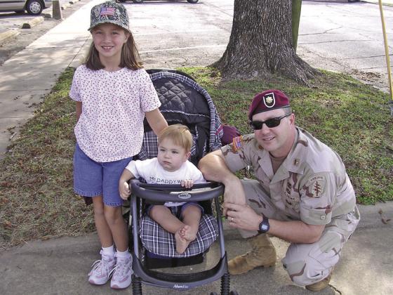 Steve is seen here with daughter Kara and son Seth after marching in Bryan - College Station Veterans Day parade November 2003.