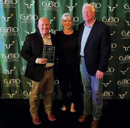 From left, Willis Braden holds the Agriculture Achievement Award with Cecilia Hedrick and Anthony Netardus.