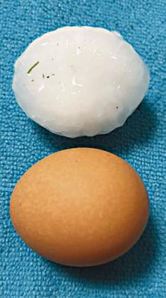 Chelsea Gloshen compares hail at her house to the size of an egg.