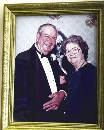 A picture of Joyce and her husband Victor from their 50th wedding anniversary hangs on the wall near her bed. CONTRIBUTED PHOTO