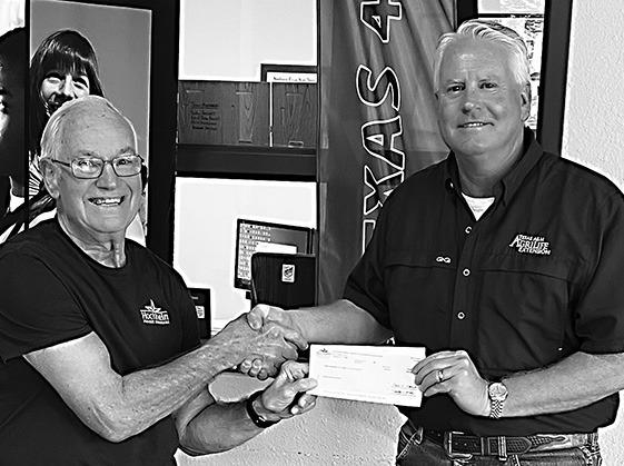 Ronnie Dietz, President of Hochheim Prairie Insurance Branch 2, presented a $250 donation to Anthony Netardus (right) for the Cuero Livestock Show. CONTRIBUTED PHOTO