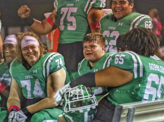 Cody Bishop, Alex Brown and other Gobbler linemen, share a well-deserved smile during their impressive victory over Giddings on Friday night.