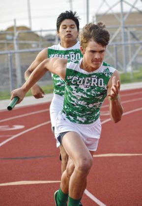 Jaxxon Marie takes off after a handoff from Tristian Reyes in the JV 4x200 relay. The team finished in second place.